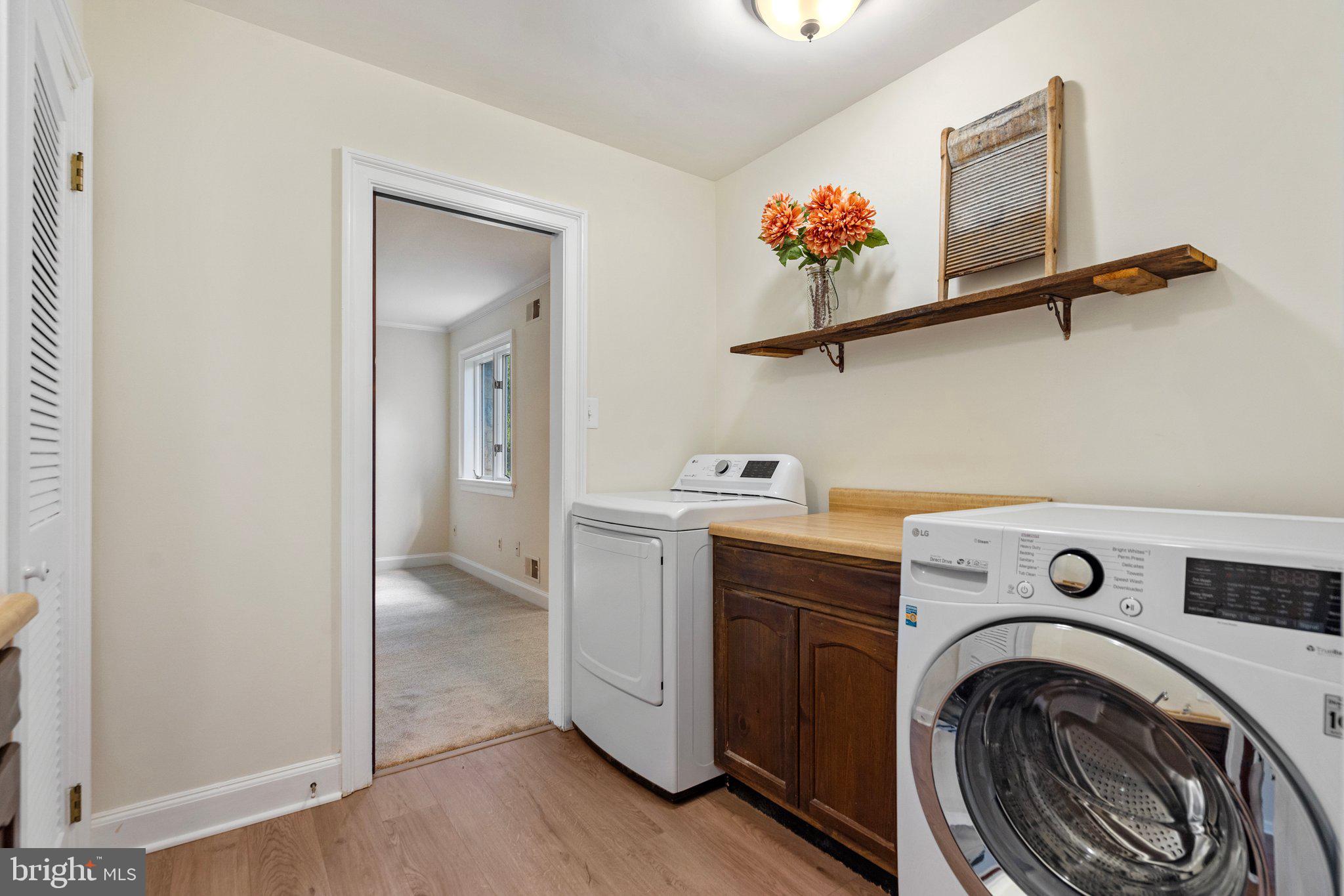 8313 Stable Gate Road Warrenton, VA 20186 - Photo 47 of 80 Laundry with pocket doors to Primary Bedroom