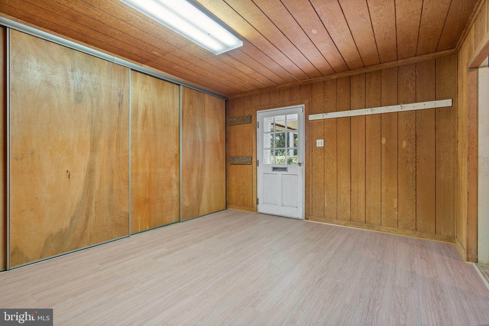 8313 Stable Gate Road Warrenton, VA 20186 - Photo 69 of 80 Tack Room Lower Level with Sliding Barn Door Stora