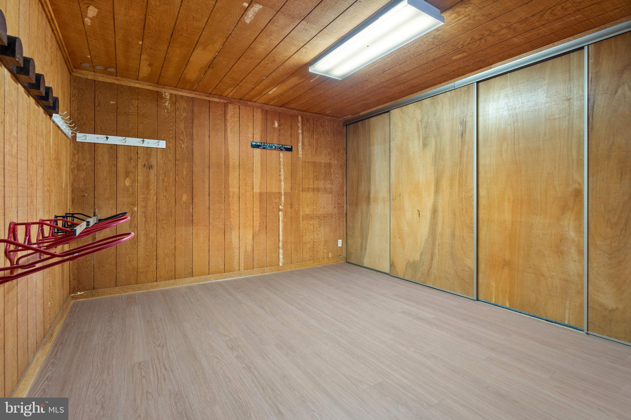8313 Stable Gate Road Warrenton, VA 20186 - Photo 70 of 80 Tack Room with Sliding Doors for Tons of Storage!