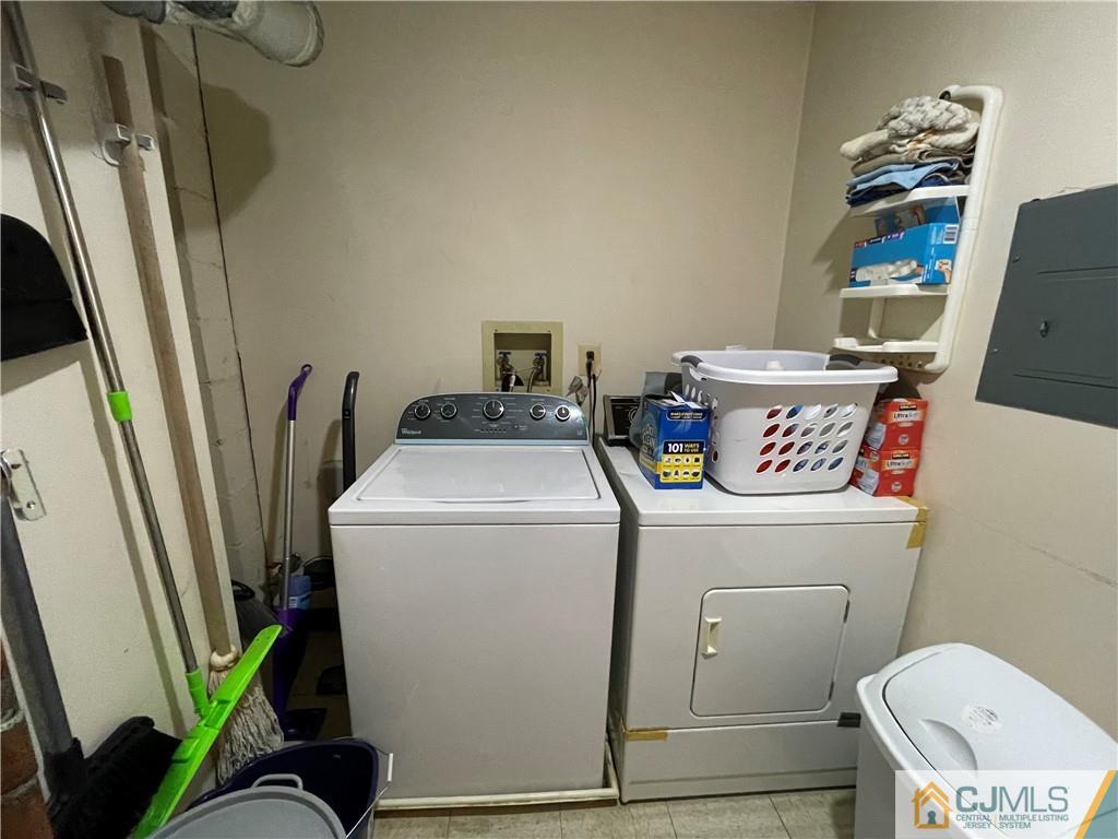 341 Wimbeldon Court North Brunswick, NJ 08902 - Photo 15 of 16 a utility room with dryer and washer