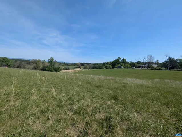 a view of a lake with houses in the back