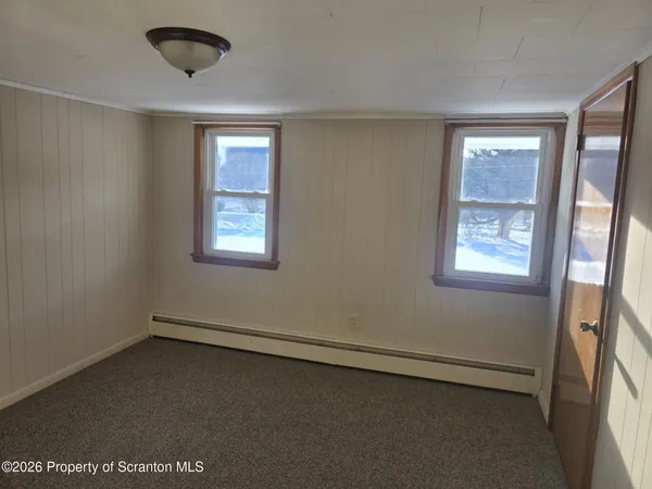 an empty room with windows