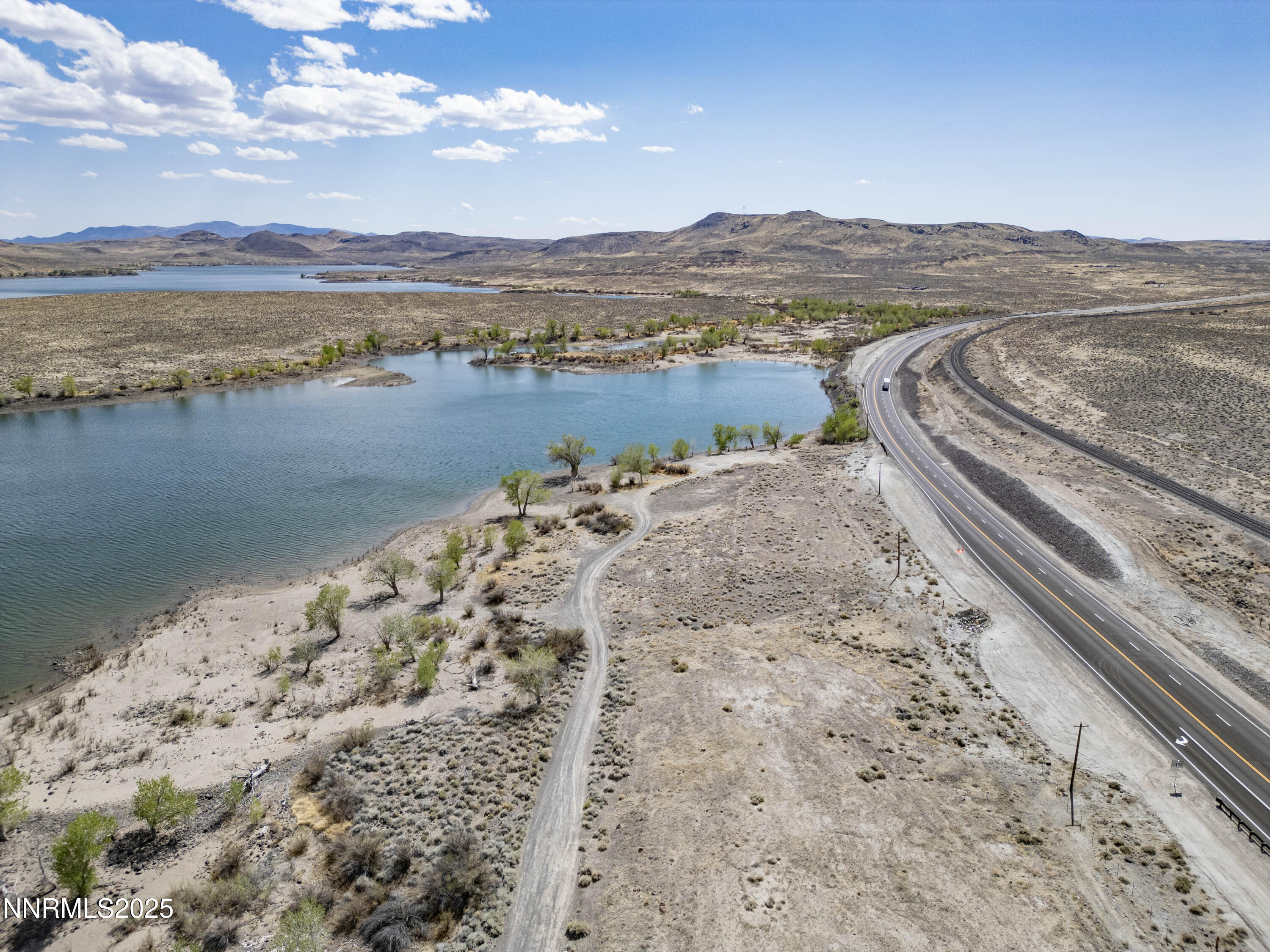 20144 Lahontan Dam Road Fallon, NV 89406 - Photo 16 of 35 a view of a lake with a mountain