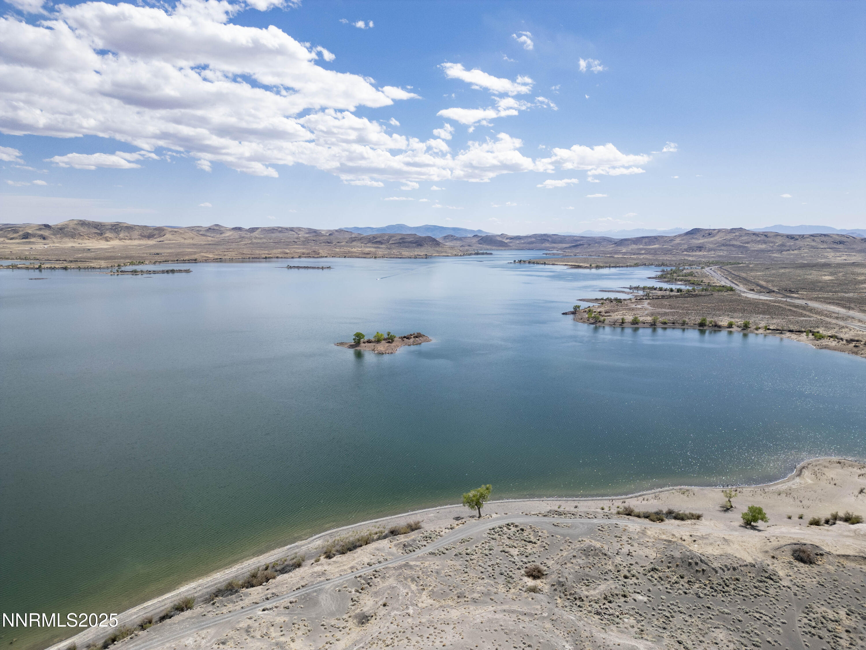 20144 Lahontan Dam Road Fallon, NV 89406 - Photo 19 of 35 a view of a lake with a beach