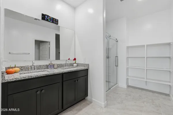 a bathroom with a glass shower door