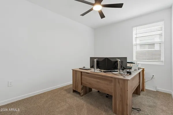 a bedroom with a bed and cabinets