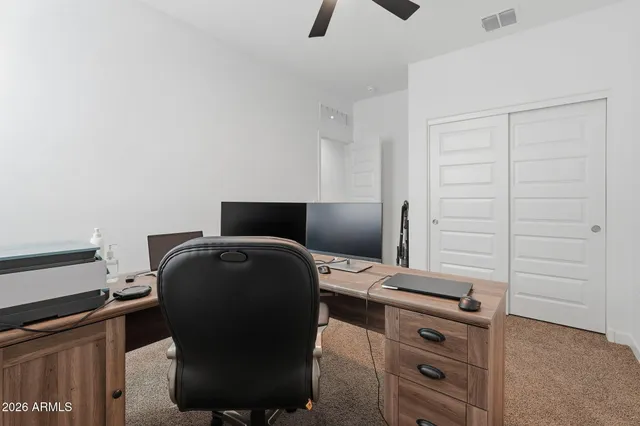 a bathroom with a granite countertop sink toilet mirror and shower