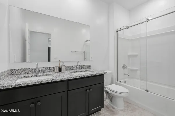 a bathroom with a shower and a toilet