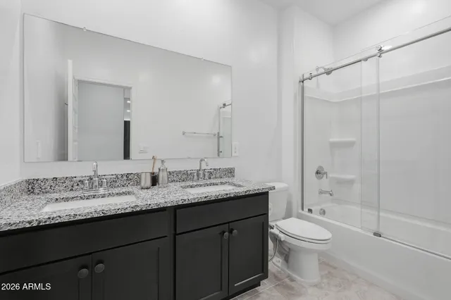 a bathroom with a shower and a toilet