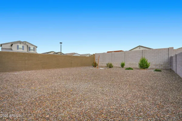a view of a back yard of the house