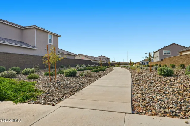 a living room with furniture kitchen and a fireplace
