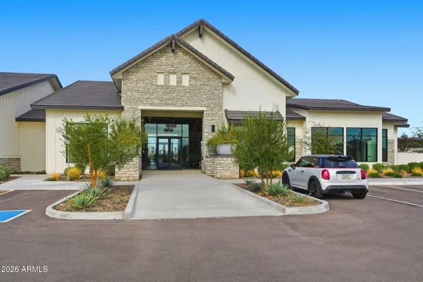 a view of a house with a backyard