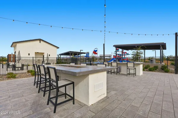 an aerial view of residential house with outdoor space and ocean view