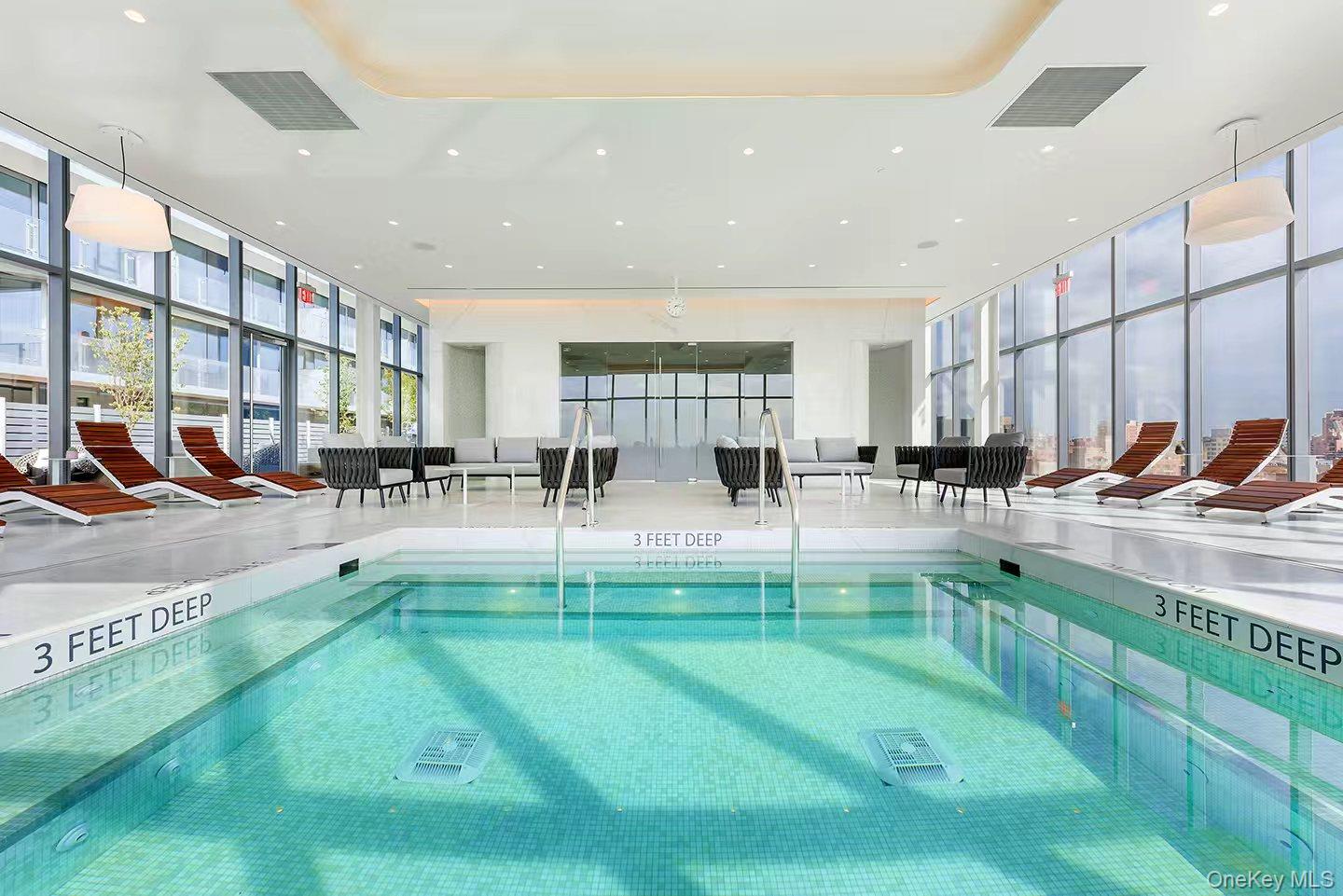 131-01 40 Road, Unit 19P Queens, NY 11354 - Photo 3 of 9 a view of a kitchen with kitchen island in the center