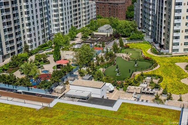 131-01 40 Road, Unit 19P Queens, NY 11354 - Photo 5 of 9 a view of swimming pool with outdoor seating