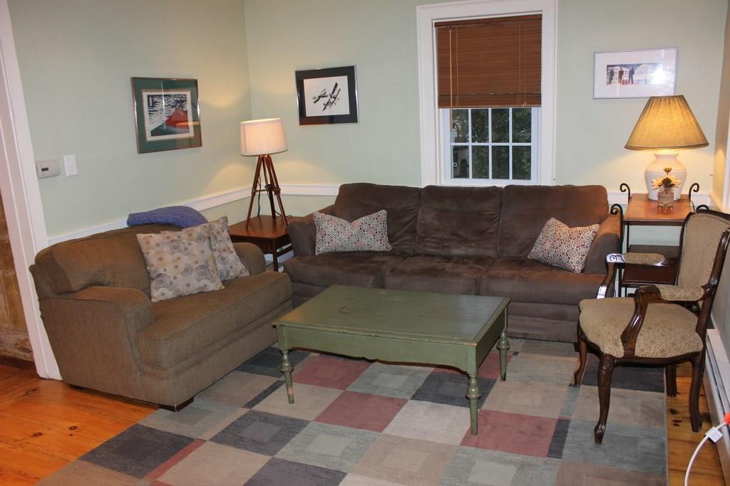 62 Kennebunk Road Alfred, ME 04002 - Photo 8 of 15 This cozy living room sits near a...
