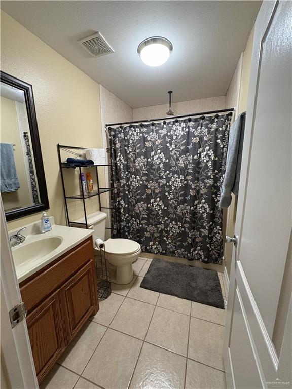 116 North Lupe Street Rio Grande City, TX 78582 - Photo 11 of 24 a bathroom with a sink toilet and shower