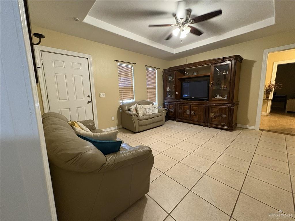 116 North Lupe Street Rio Grande City, TX 78582 - Photo 14 of 24 a living room with furniture and a flat screen tv