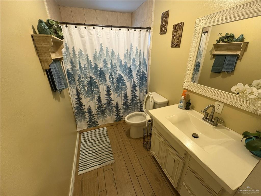 116 North Lupe Street Rio Grande City, TX 78582 - Photo 19 of 24 a bathroom with a sink and a mirror