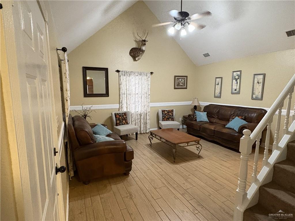 116 North Lupe Street Rio Grande City, TX 78582 - Photo 23 of 24 a living room with furniture and a wooden floor
