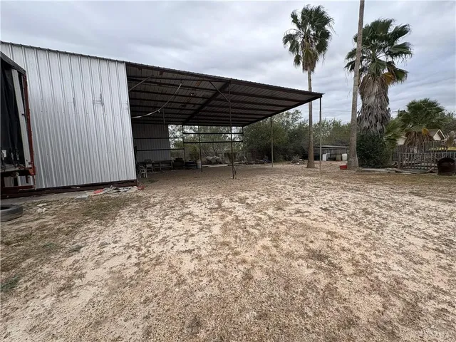 a view of a backyard of a house