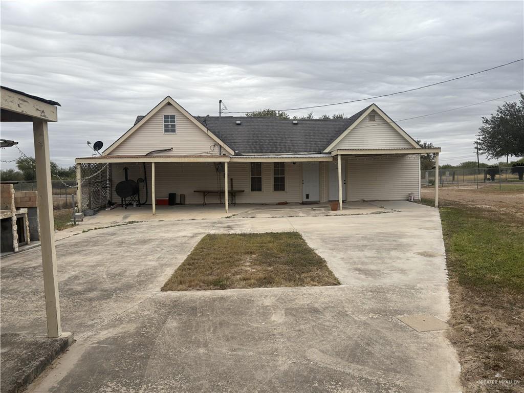 116 North Lupe Street Rio Grande City, TX 78582 - Photo 5 of 24 a view of a house with a yard