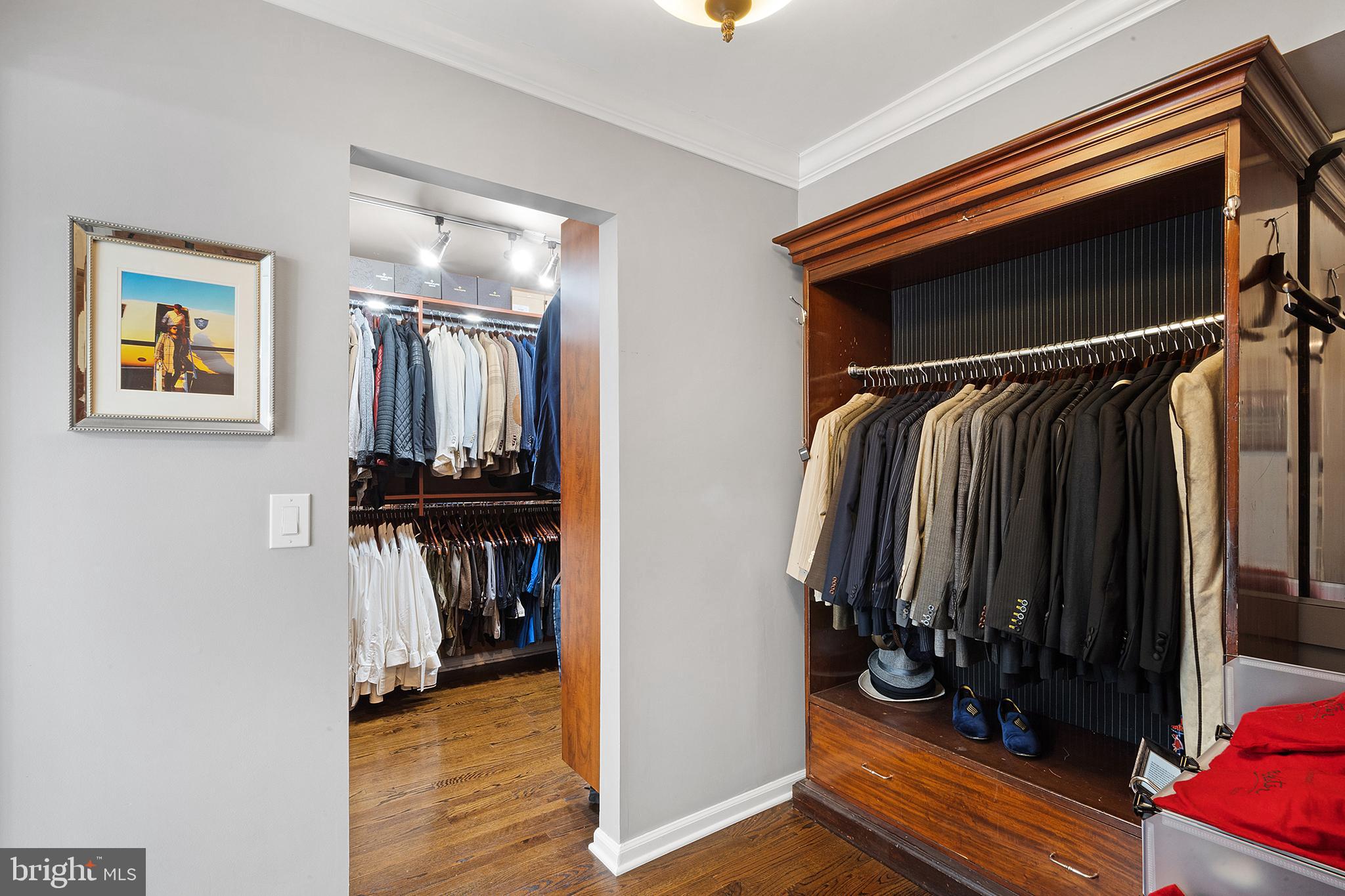 209 Lake Road Basking Ridge, NJ 07920 - Photo 23 of 40 a view of walk in closet with clothes and shoes