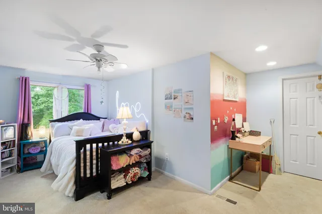 a bed room with furniture and a window