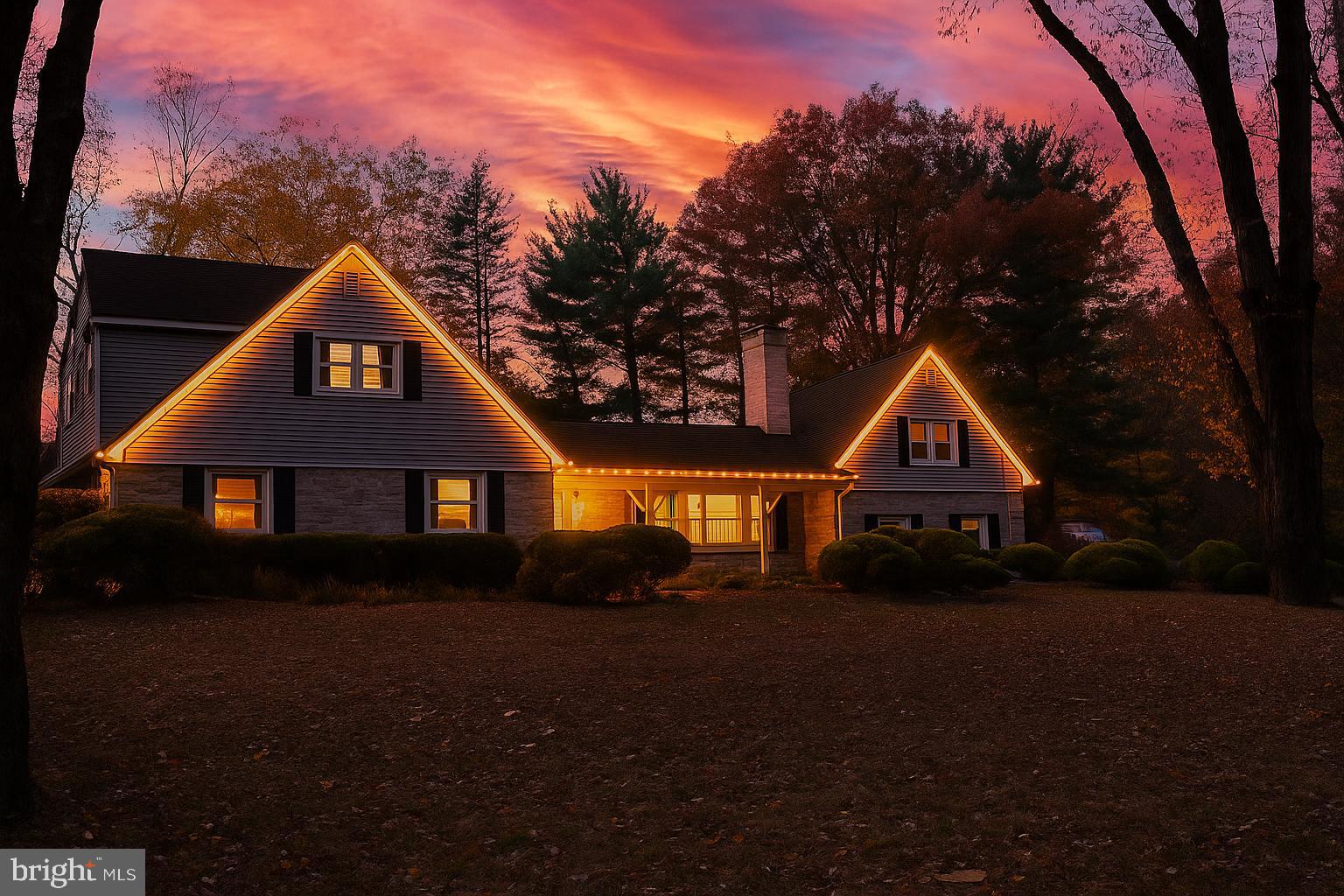 209 Lake Road Basking Ridge, NJ 07920 - Photo 3 of 40 a front view of a house with a yard and garage