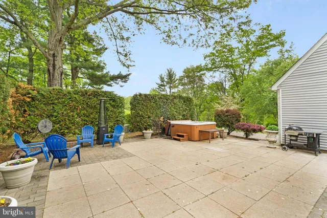 a view of a patio with table and chairs and potted plants