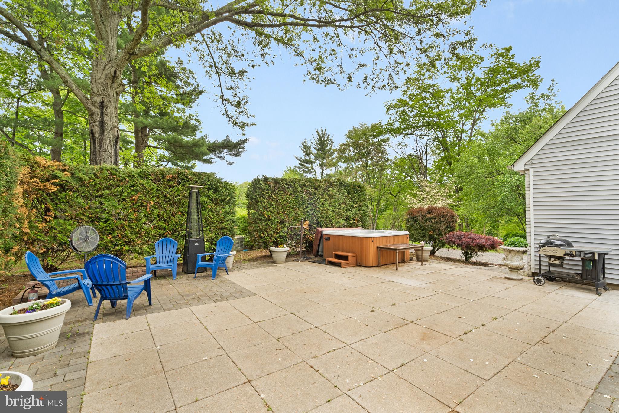 209 Lake Road Basking Ridge, NJ 07920 - Photo 33 of 40 a view of a patio with table and chairs and potted plants