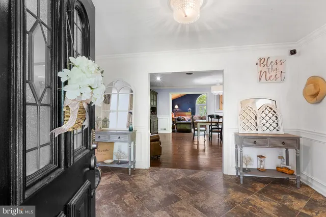 a view of a livingroom with furniture and a kitchen
