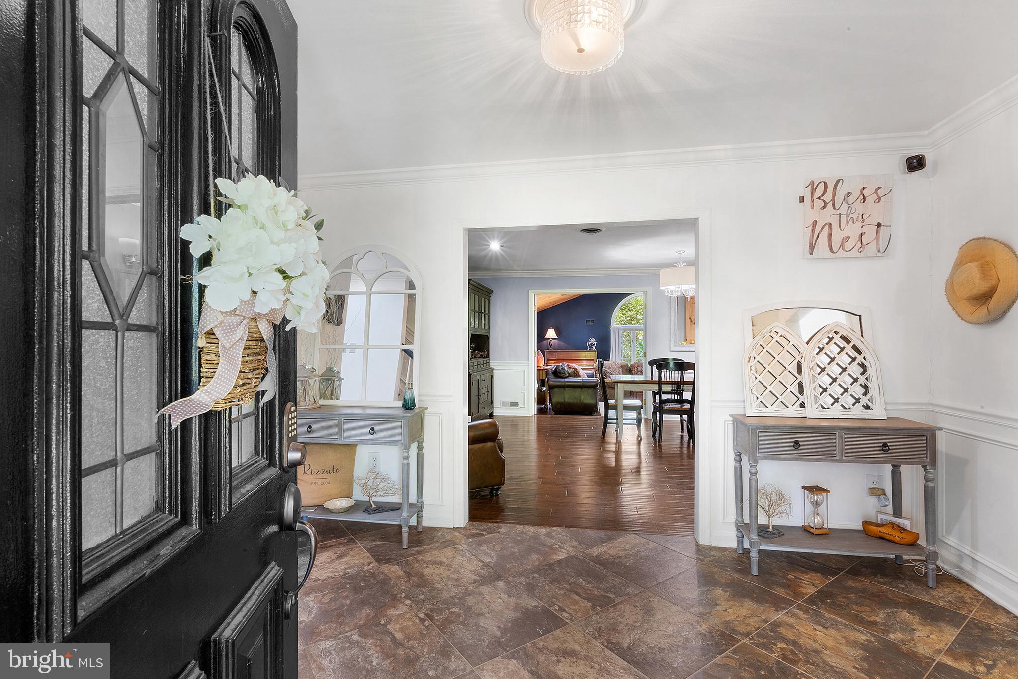 209 Lake Road Basking Ridge, NJ 07920 - Photo 9 of 40 a view of a livingroom with furniture and a kitchen