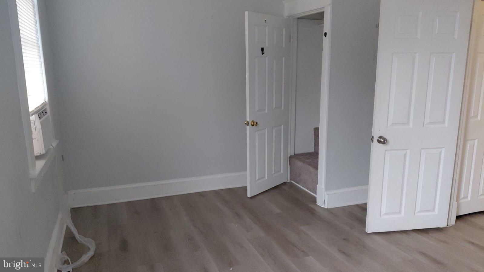 2518 Barclay Street Baltimore, MD 21218 - Photo 12 of 16 a view of a hallway with wooden floor