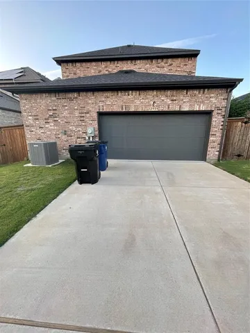 a view of pathway with brick wall