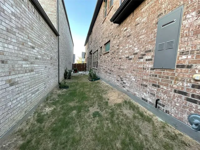 a bedroom with a bed couch and window