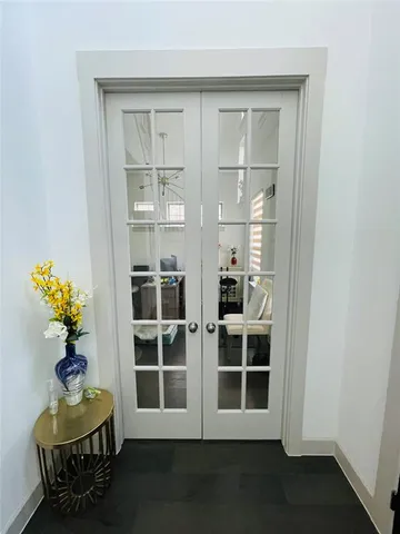 a view of wooden door in a room