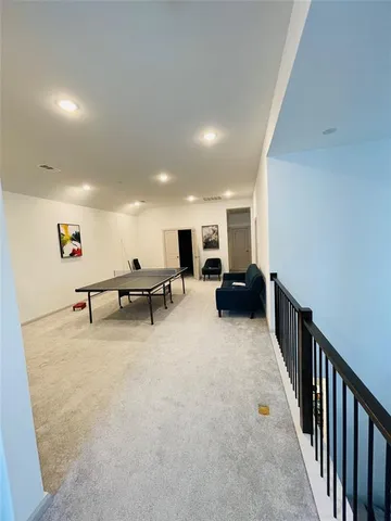 a view of a livingroom with furniture and a projector