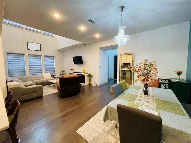 a living room with furniture fireplace and flat screen tv