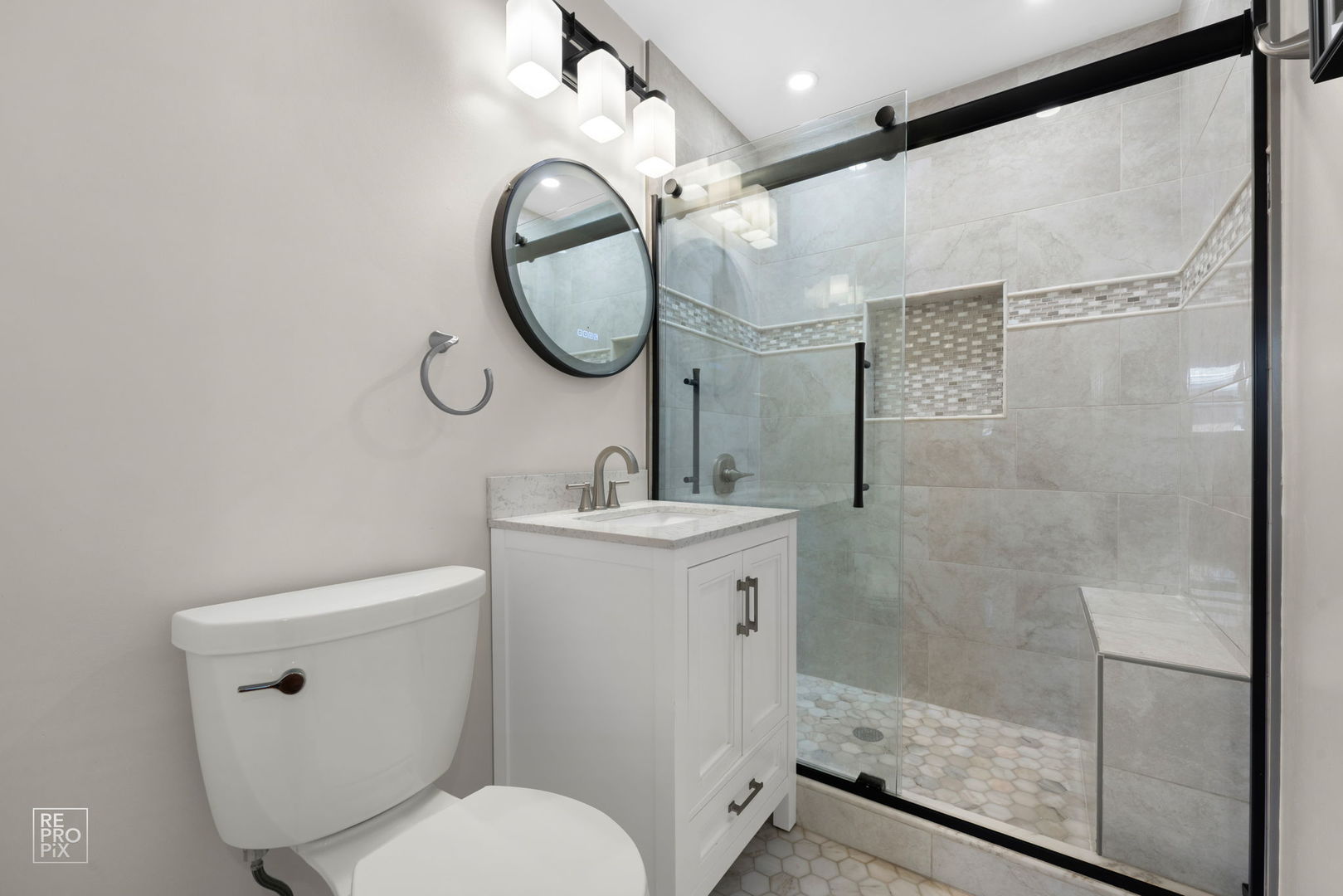 4433 Madison Avenue Brookfield, IL 60513 - Photo 13 of 16 a bathroom with a toilet sink vanity granite and a mirror
