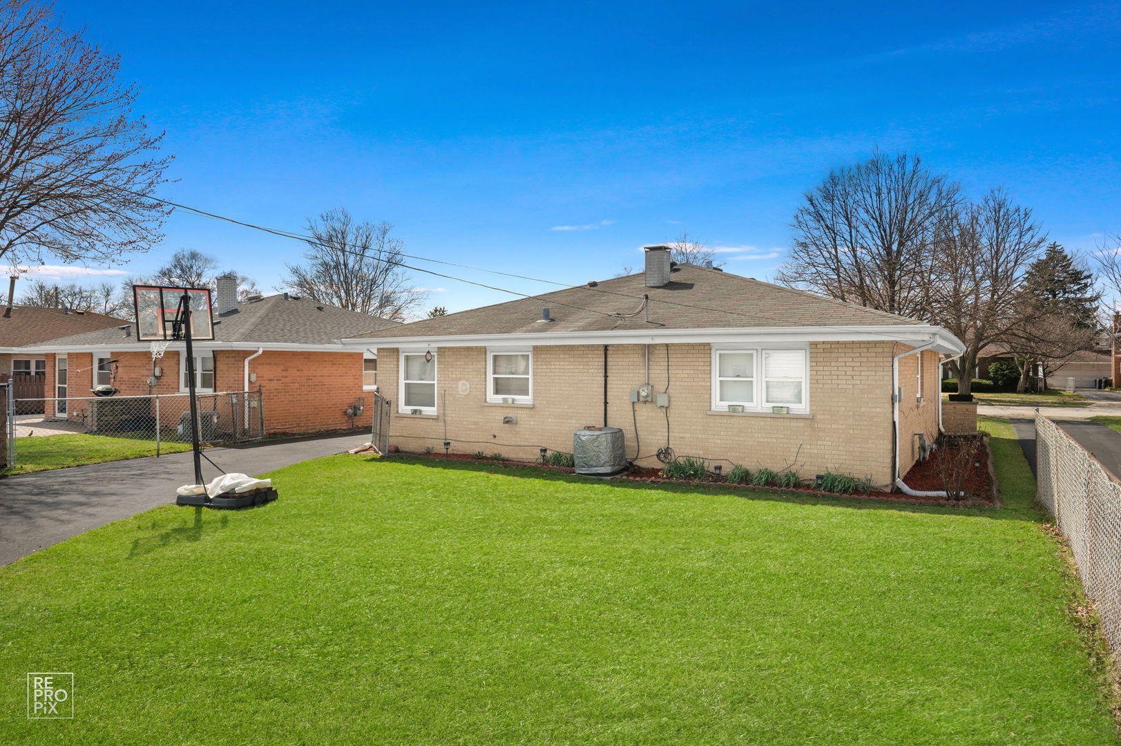 4433 Madison Avenue Brookfield, IL 60513 - Photo 16 of 16 a front view of a house with a garden