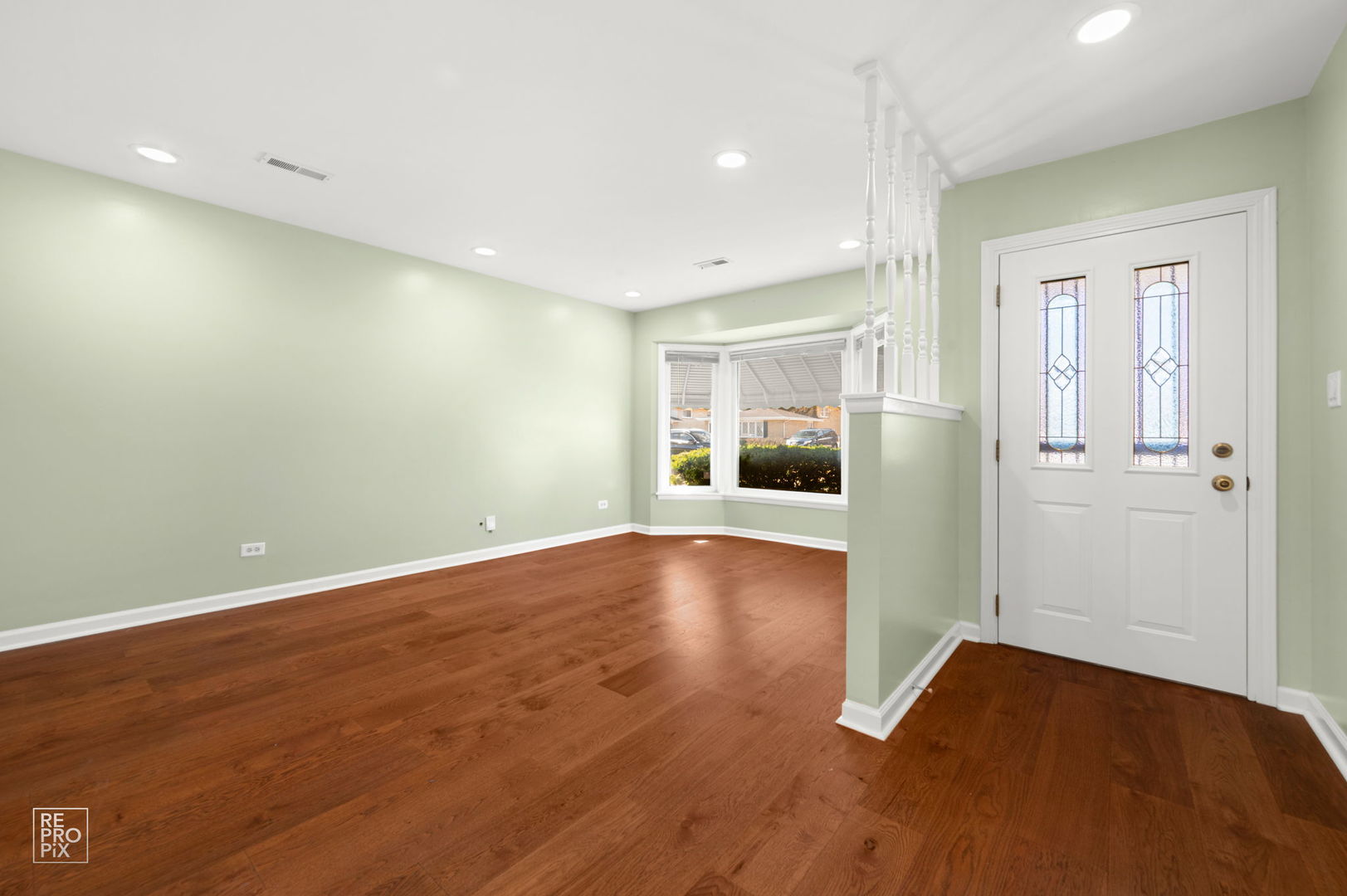 4433 Madison Avenue Brookfield, IL 60513 - Photo 3 of 16 a view of empty room with wooden floor and kitchen