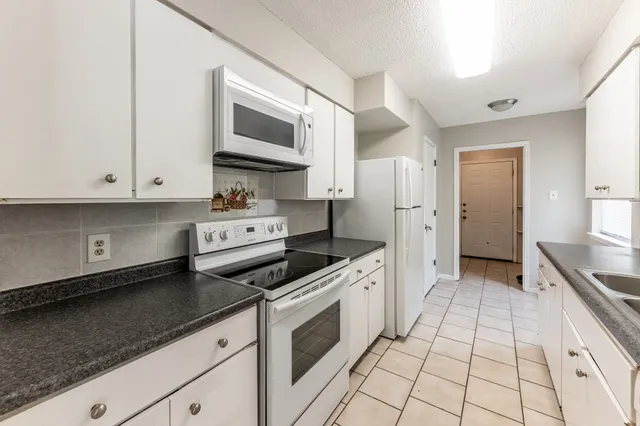 a kitchen with a stove and a microwave