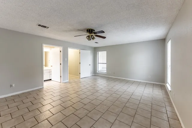a view of an empty room and window