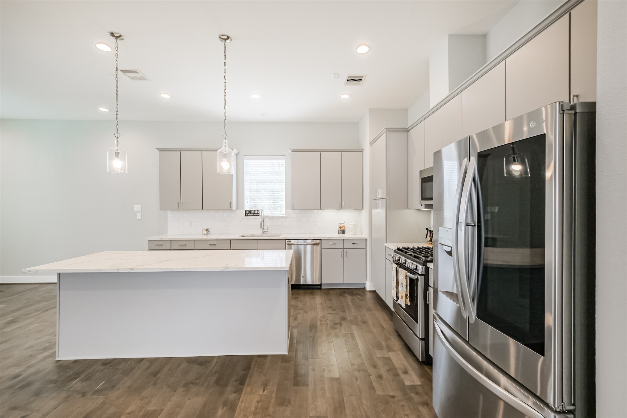 1305 Mayfair Clarkson Lane Houston, TX 77055 - Photo 12 of 34 High end Fridge / Freezer will be remaining with the home.