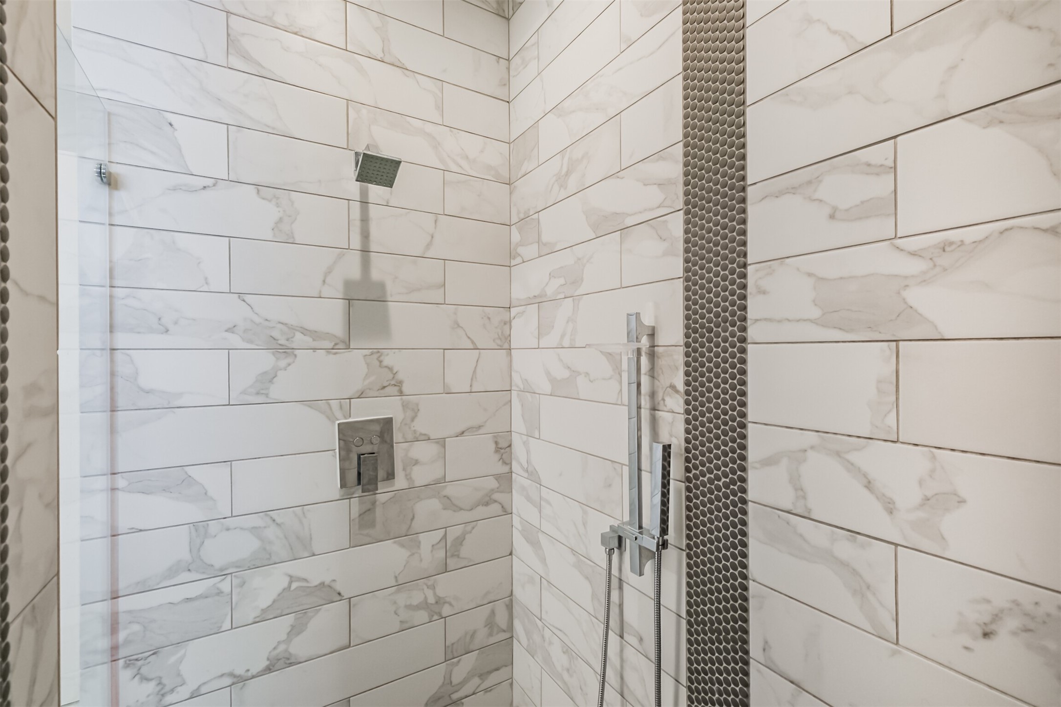 1305 Mayfair Clarkson Lane Houston, TX 77055 - Photo 27 of 34 The walk in shower includes stainless steel finishes, and a full glass door.