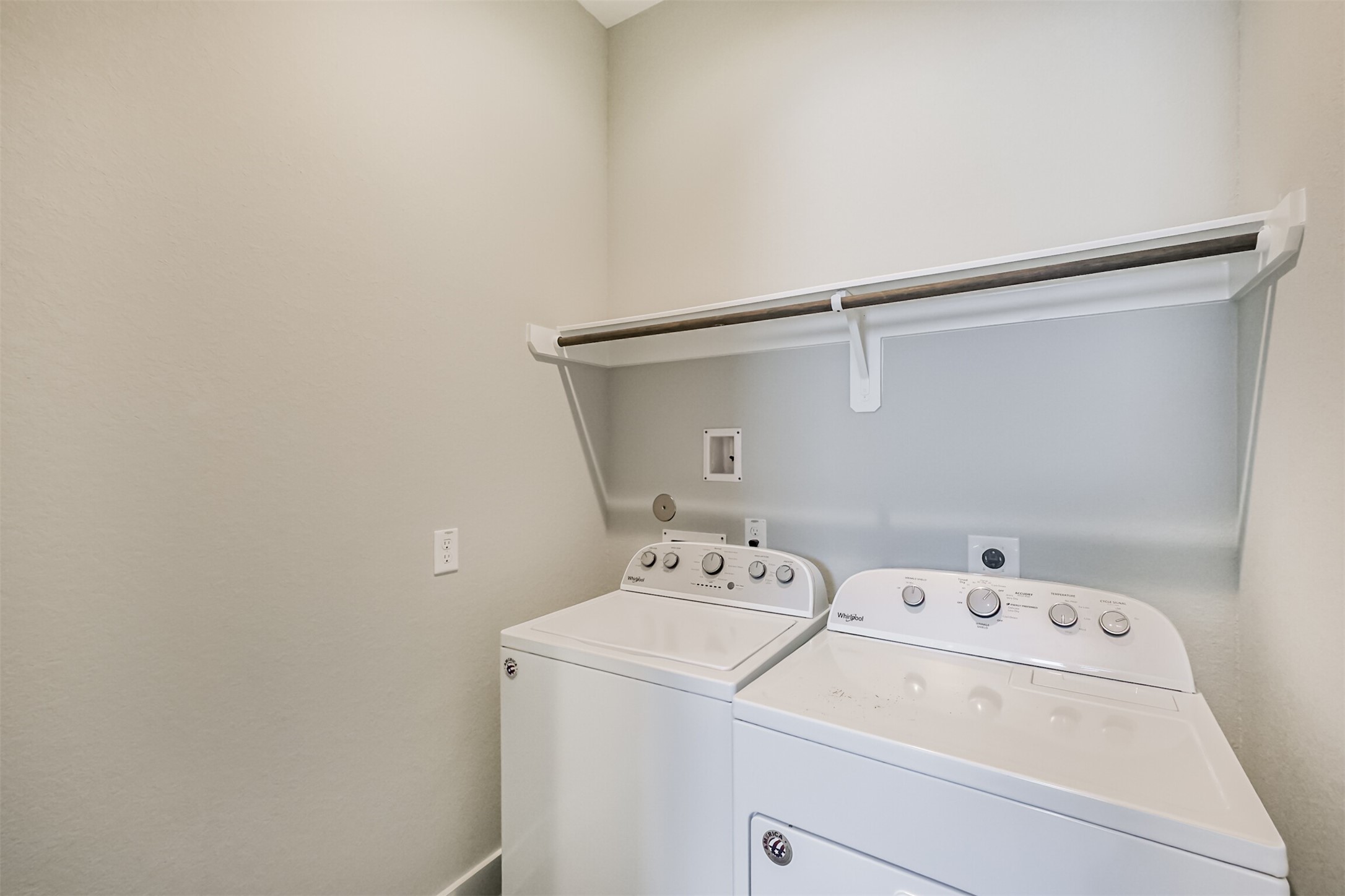 1305 Mayfair Clarkson Lane Houston, TX 77055 - Photo 29 of 34 The laundry room offers shelving for easy storage and washer / dryer will remain.