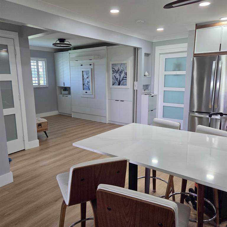 300 Southwest Golfview Terrace, Unit 135 Boynton Beach, FL 33426 - Photo 12 of 25 a bedroom with furniture and window