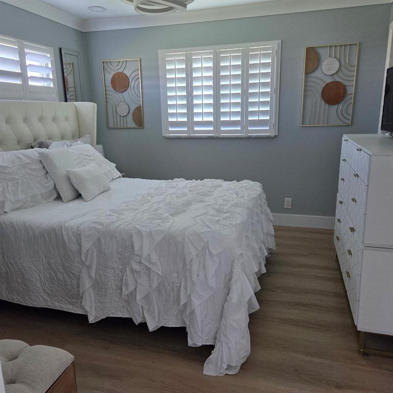 300 Southwest Golfview Terrace, Unit 135 Boynton Beach, FL 33426 - Photo 15 of 25 a bedroom with a bed and window