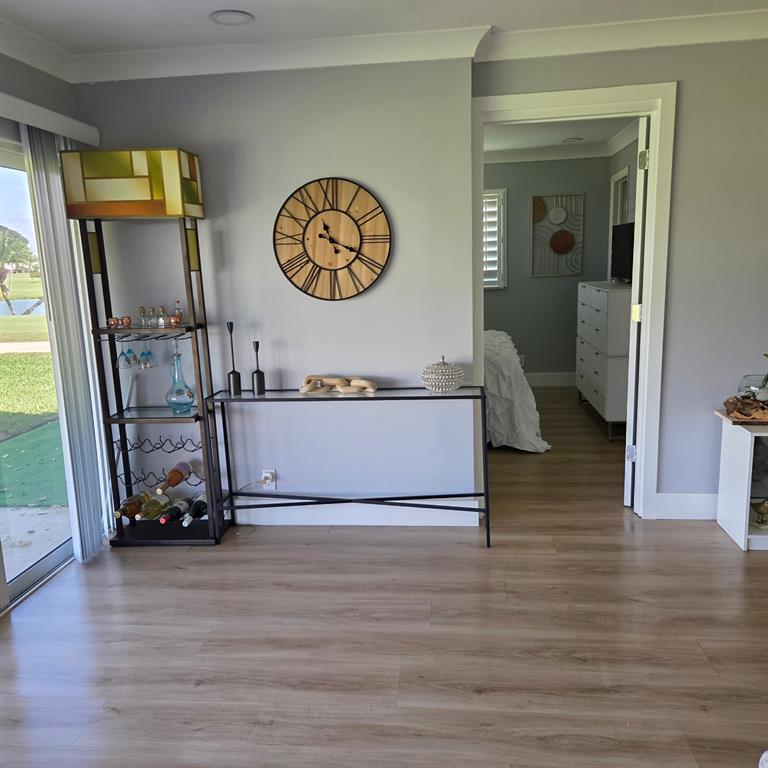 300 Southwest Golfview Terrace, Unit 135 Boynton Beach, FL 33426 - Photo 23 of 25 a view of a hallway with wooden floor and door